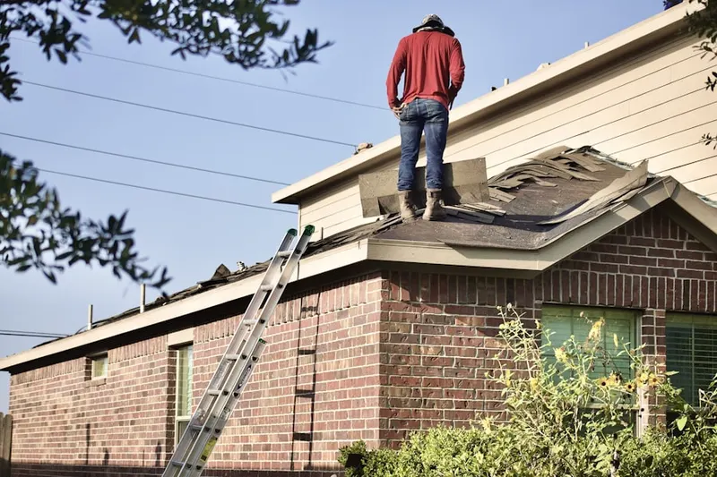 Professional roofer working on a residential roof in Santa Monica